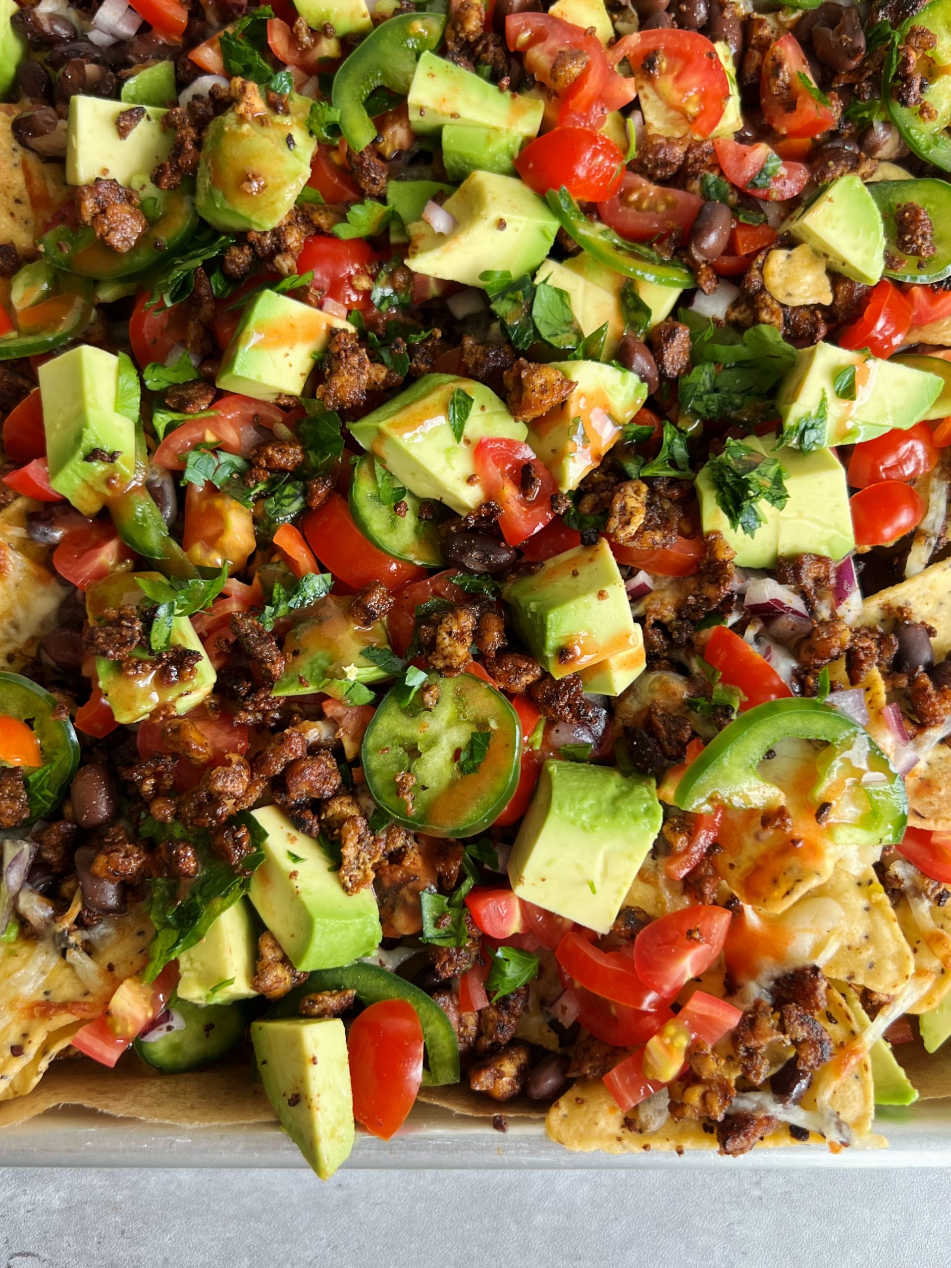 Loaded Vegan Nachos with Black Beans and Spicy Chickpeas