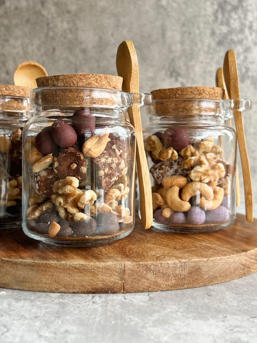 Colorful Honey With Fruit And Nuts Canned In The Glass Jar, On A